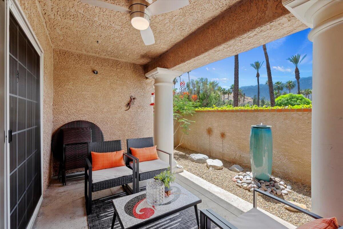 2700 Lawrence Crossley Road, Unit 10 Palm Springs, CA 92264 - Photo 5 of 15 a living room with furniture and a large window