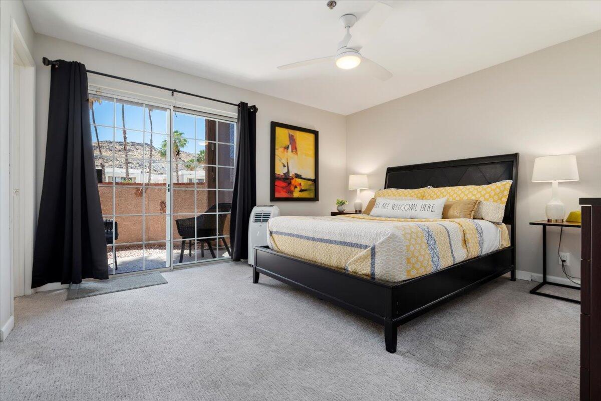 2700 Lawrence Crossley Road, Unit 10 Palm Springs, CA 92264 - Photo 9 of 15 a bedroom with a bed and a window