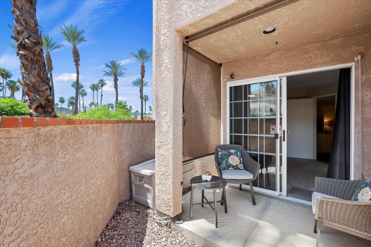 2700 Lawrence Crossley Road, Unit 10 Palm Springs, CA 92264 - Photo 10 of 15 a outdoor space with patio furniture and potted plants