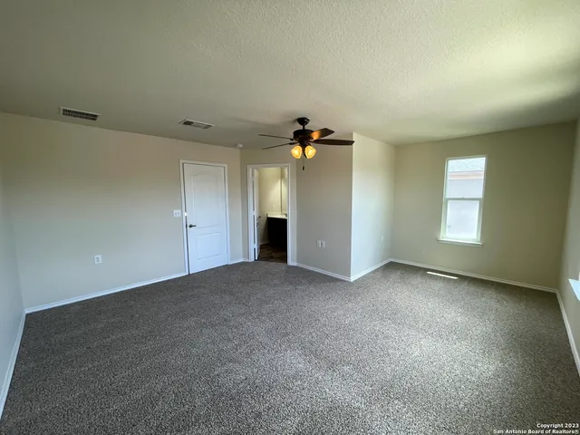 a bathroom with a double vanity sink mirror and toilet