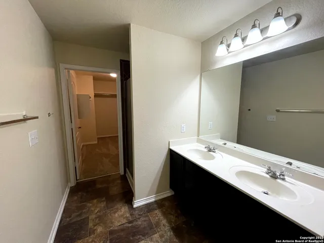 a view of balcony with wooden floor and fence