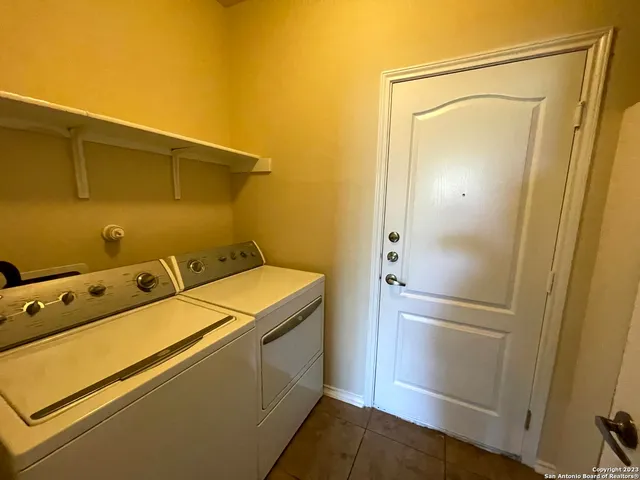 a bathroom with a sink a toilet a shower and a mirror