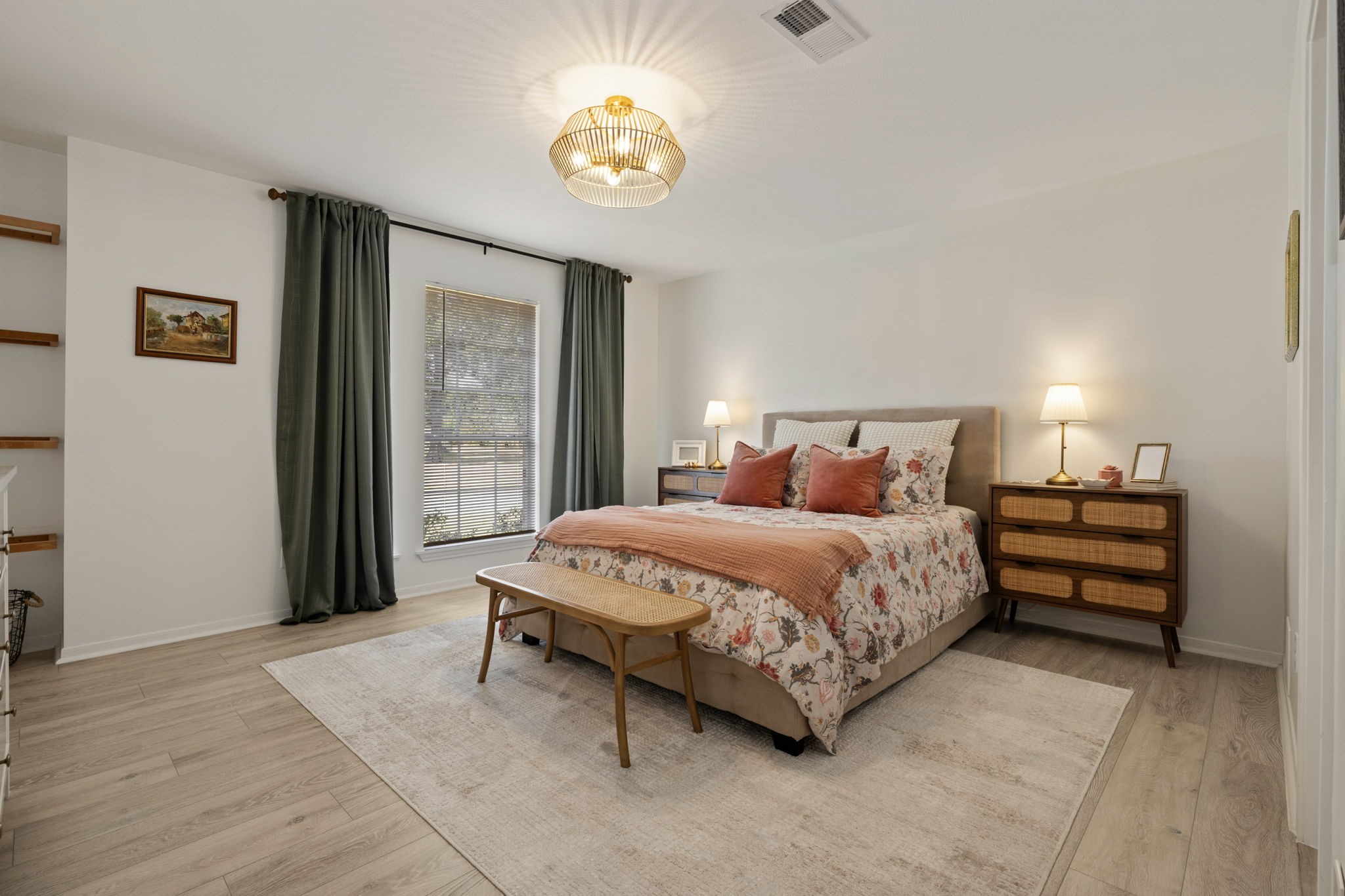 2106 Lexington Woods Drive Spring, TX 77373 - Photo 14 of 27 a bedroom with a bed and a chandelier