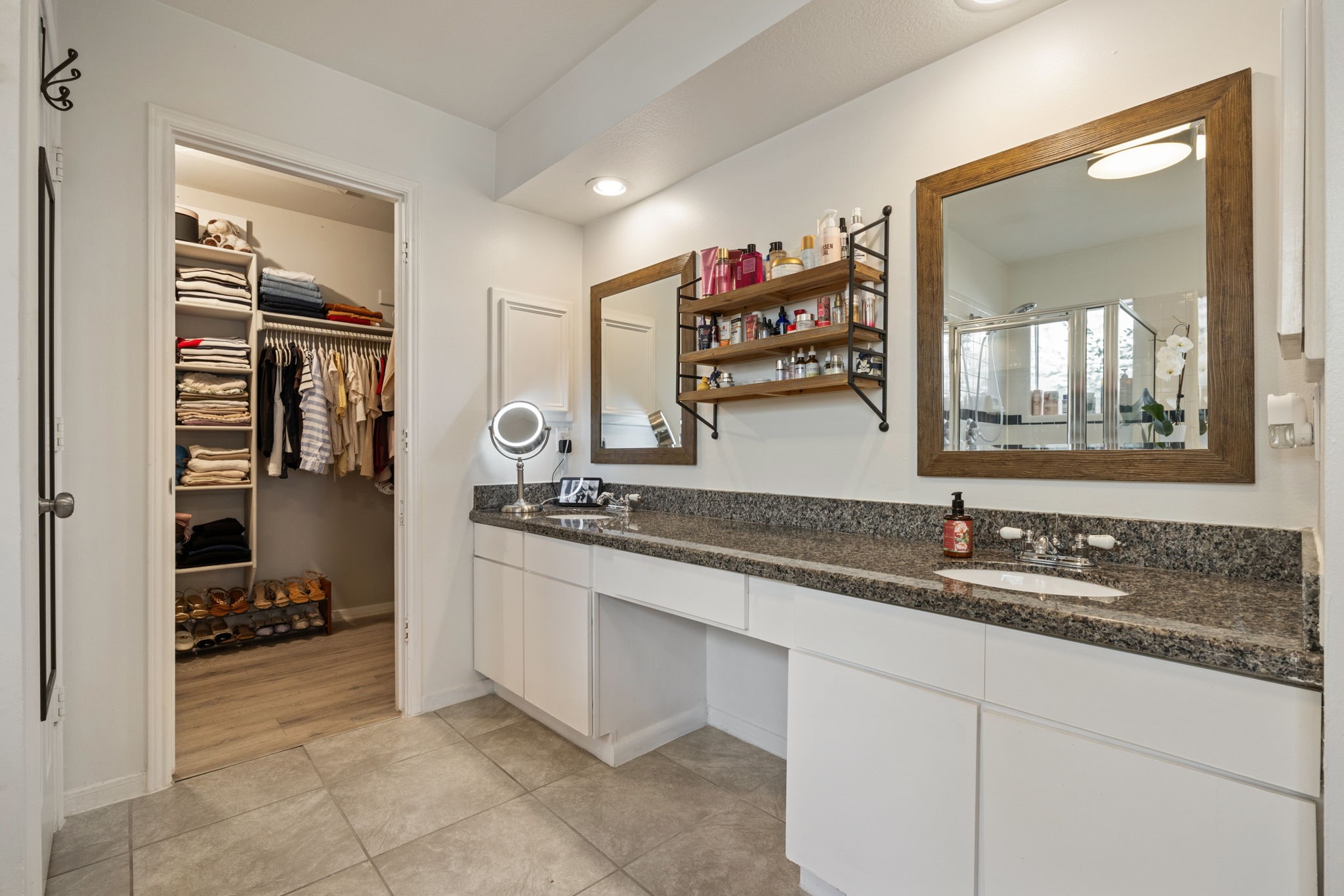 2106 Lexington Woods Drive Spring, TX 77373 - Photo 17 of 27 a bathroom with a sink and a mirror