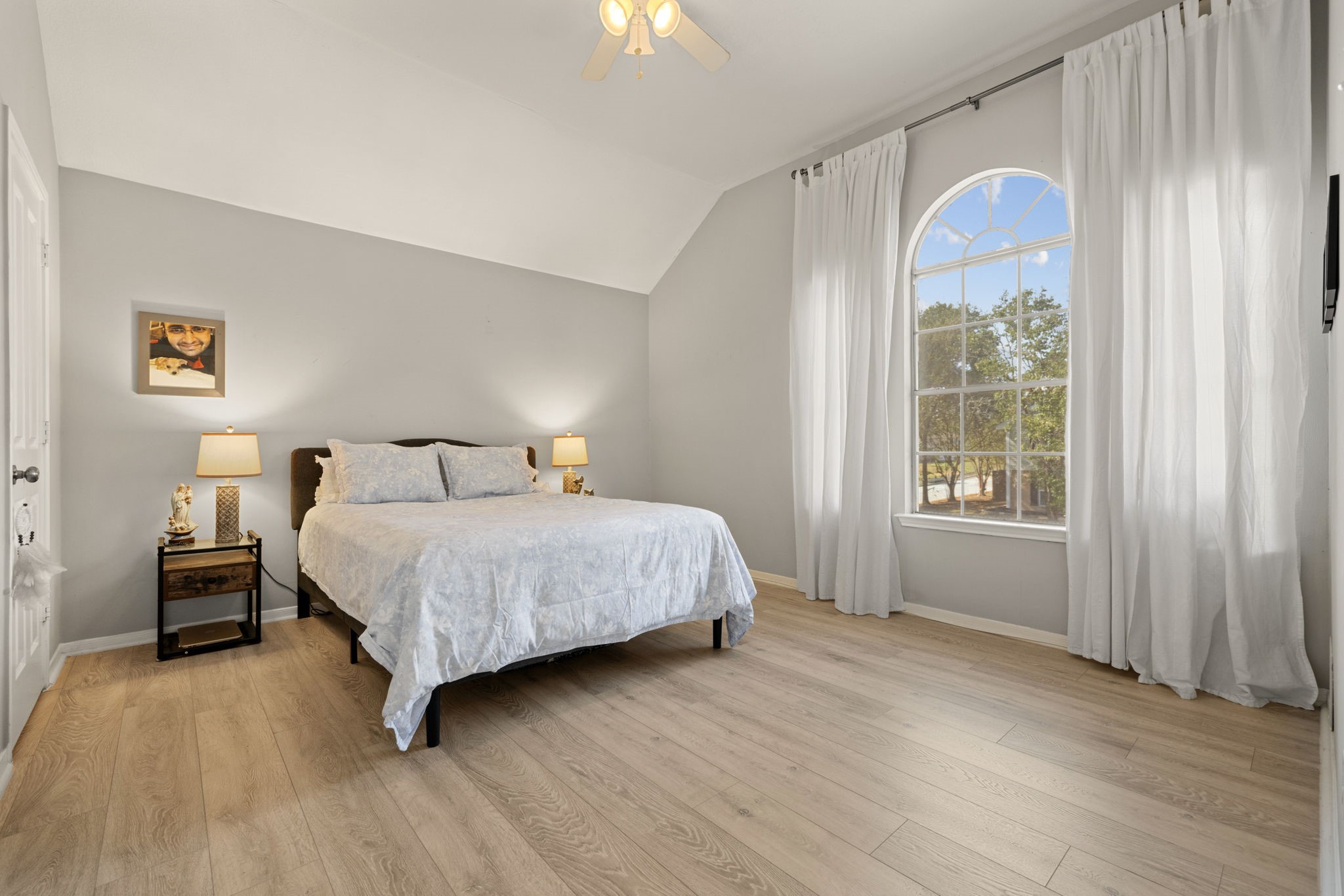 2106 Lexington Woods Drive Spring, TX 77373 - Photo 19 of 27 a bedroom with a bed and a window