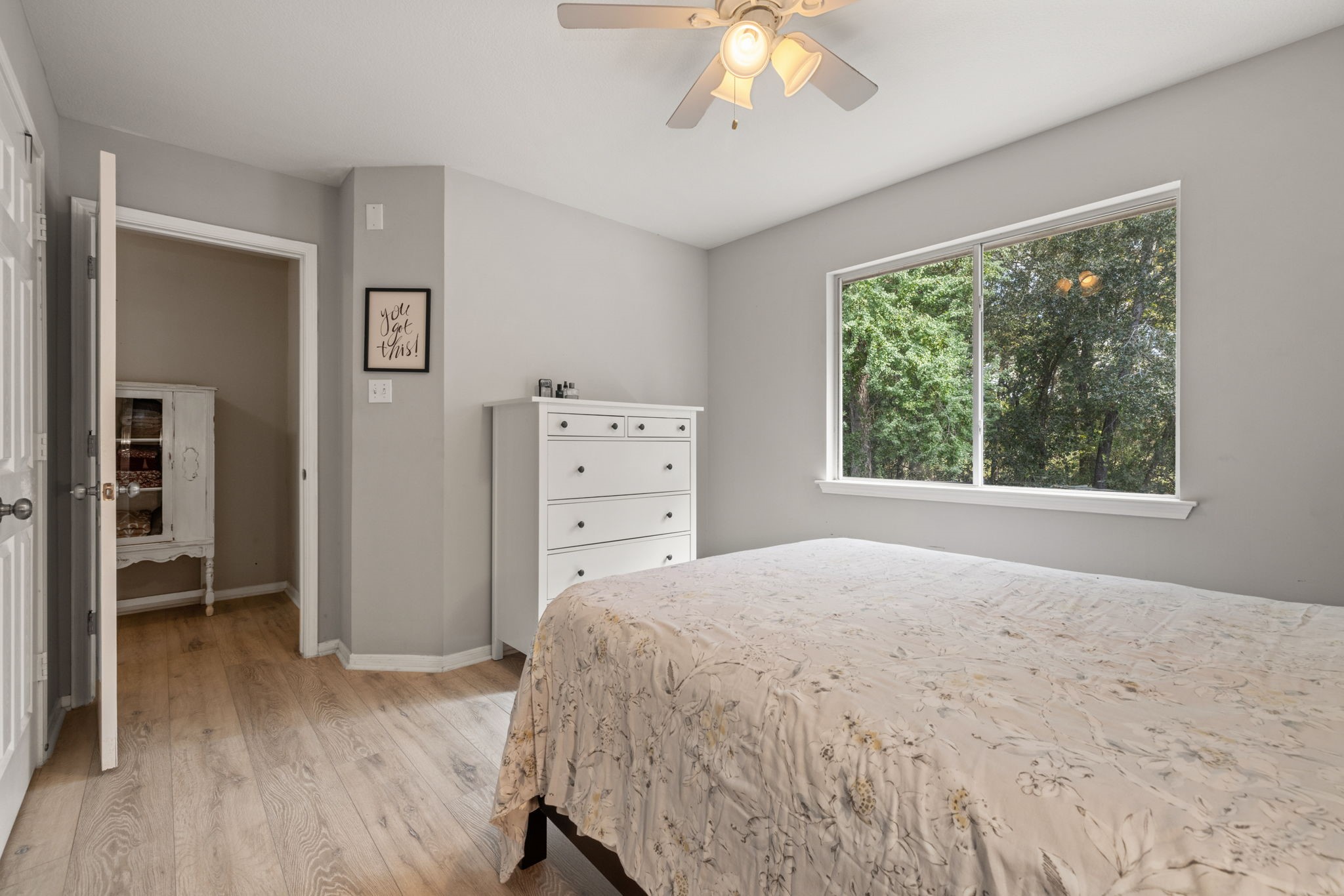 2106 Lexington Woods Drive Spring, TX 77373 - Photo 22 of 27 a bedroom with a bed and a window