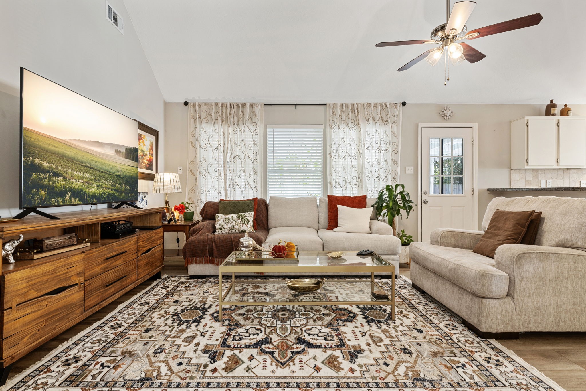 2106 Lexington Woods Drive Spring, TX 77373 - Photo 7 of 27 a living room with furniture and a flat screen tv
