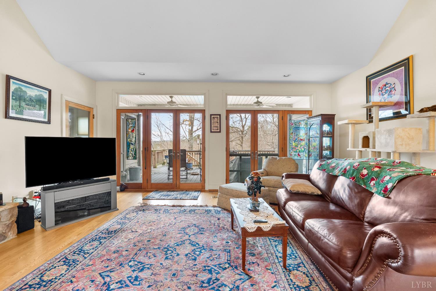 2481 School Crossing Road Lynch Station, VA 24571 - Photo 13 of 47 a living room with furniture and a flat screen tv