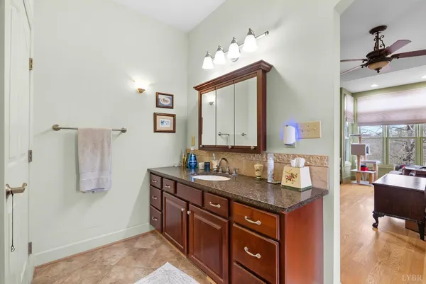 a bedroom with a bed and a dresser in it