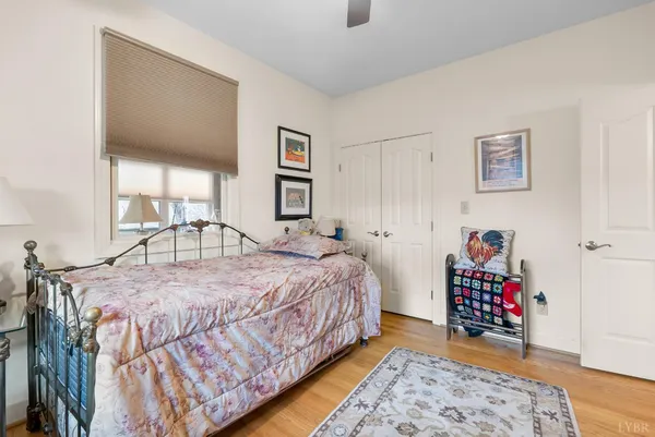 a bathroom with a granite countertop tub sink and mirror