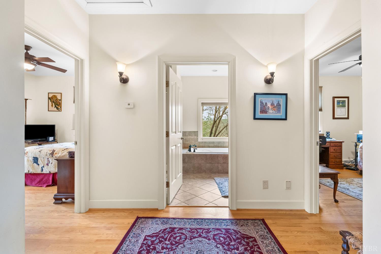 2481 School Crossing Road Lynch Station, VA 24571 - Photo 27 of 47 a view of a hallway view with wooden floor and bathroom