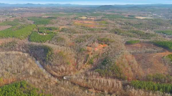 view of a kitchen with refrigerator and mirror