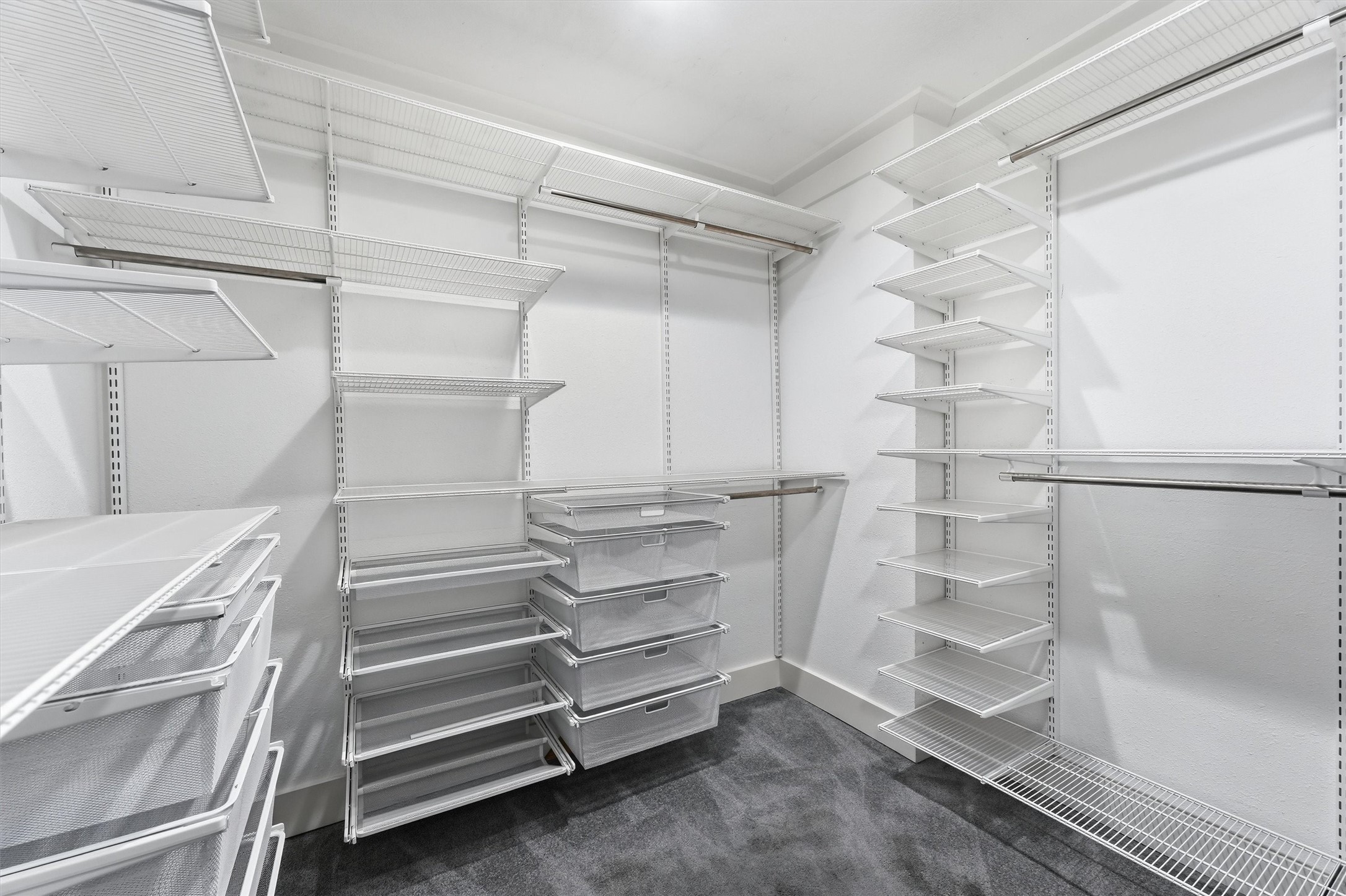 4701 Hummingbird Street Houston, TX 77035 - Photo 17 of 28 The massive primary closet! With adjustable shelving, you can craft this space to suit your needs. Please note, the carpet in this closet is getting replaced.