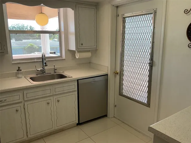 a bedroom with a bed and a lamp