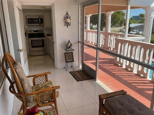a view of a house with a backyard and sitting area