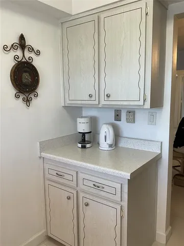 a kitchen with sink and window