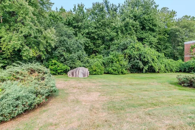 a front view of a house with parking