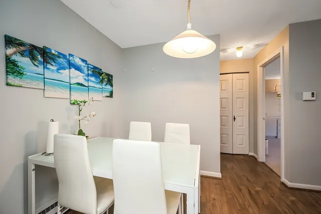 a dining room with wooden floor