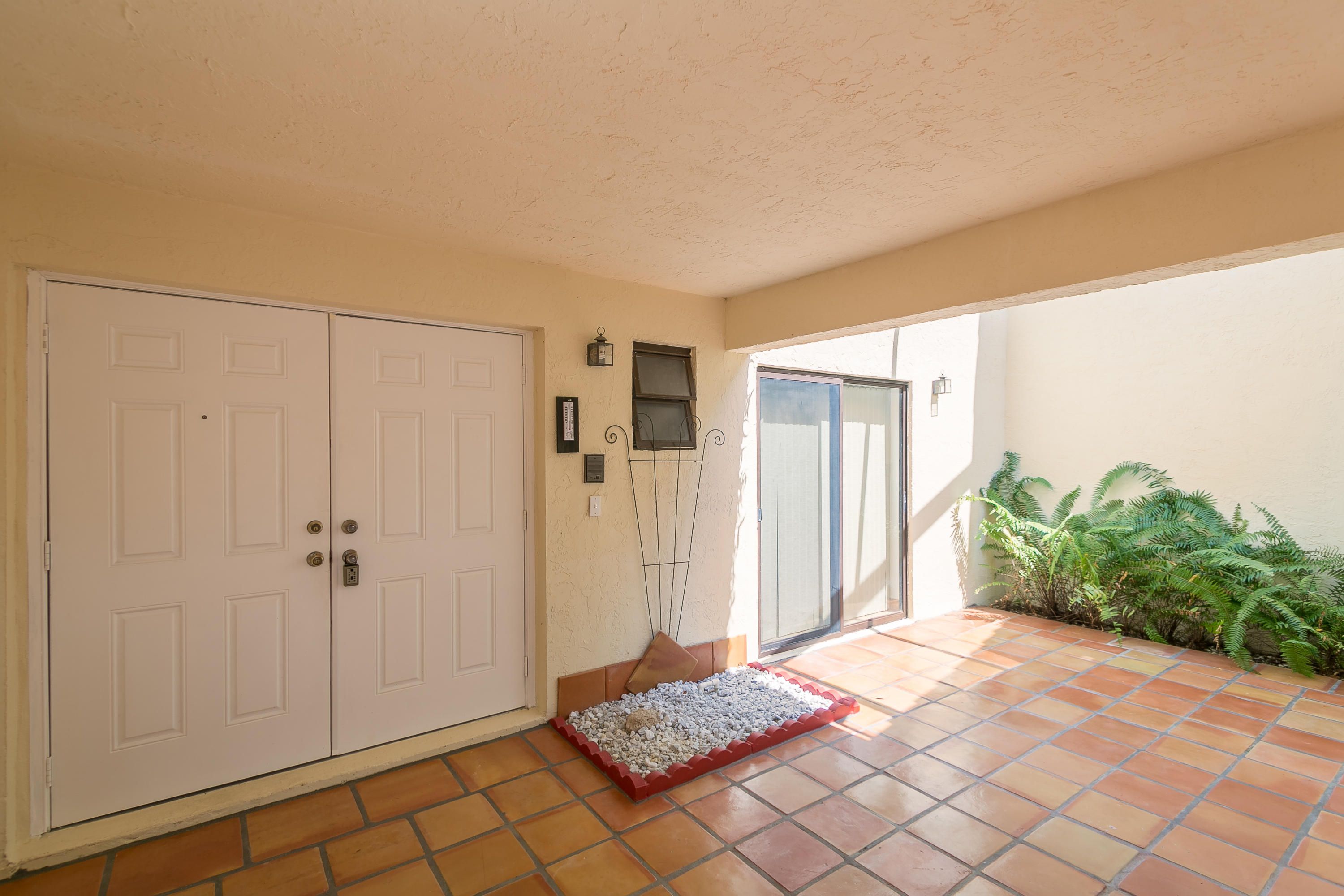 6850 Northwest 2nd Avenue, Unit 290 Boca Raton, FL 33487 - Photo 5 of 17 Front Entrance - Open/Covered Patio Area
