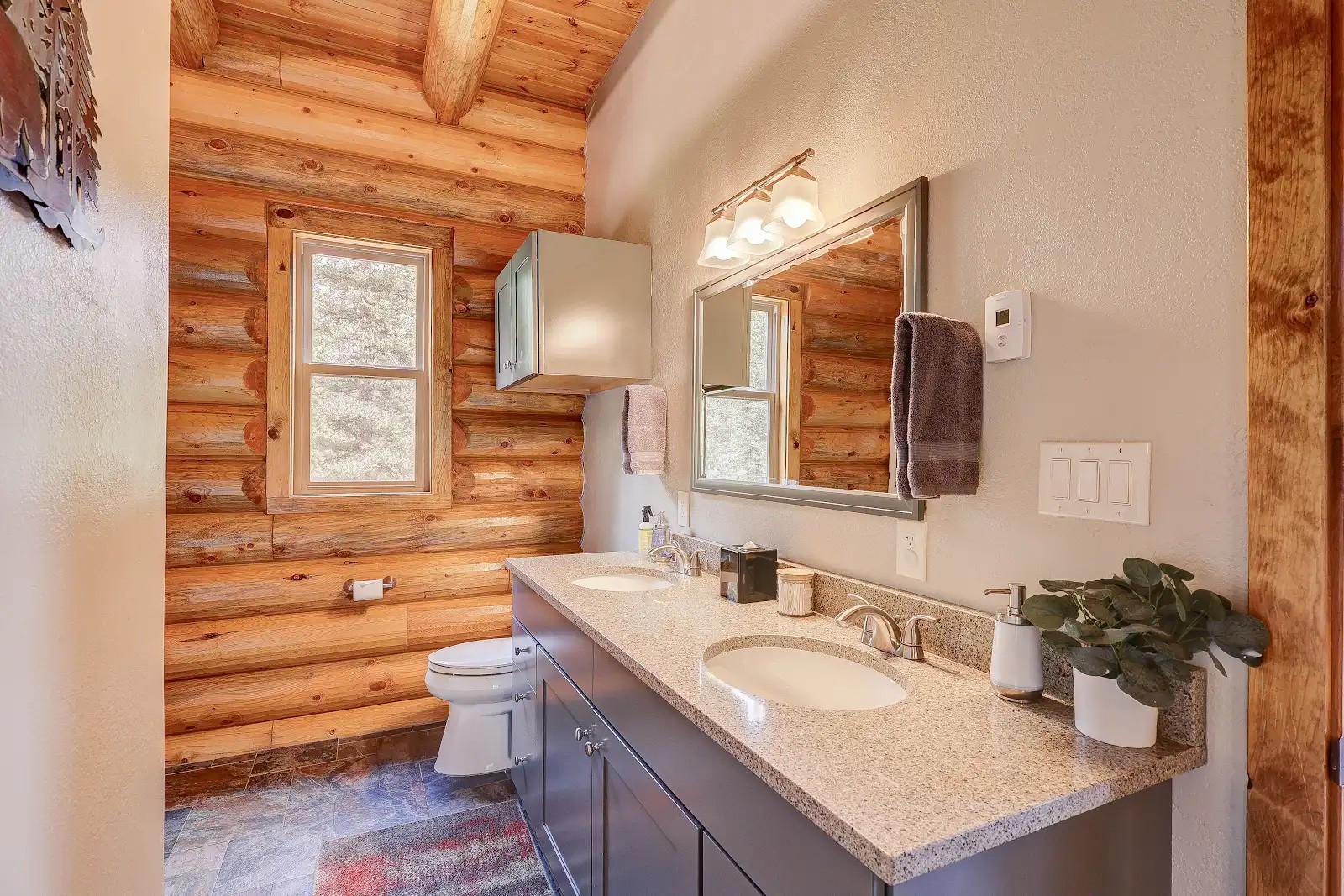 395 Miners Way Fairplay, CO 80440 - Photo 11 of 43 a bathroom with a granite countertop sink mirror and a toilet