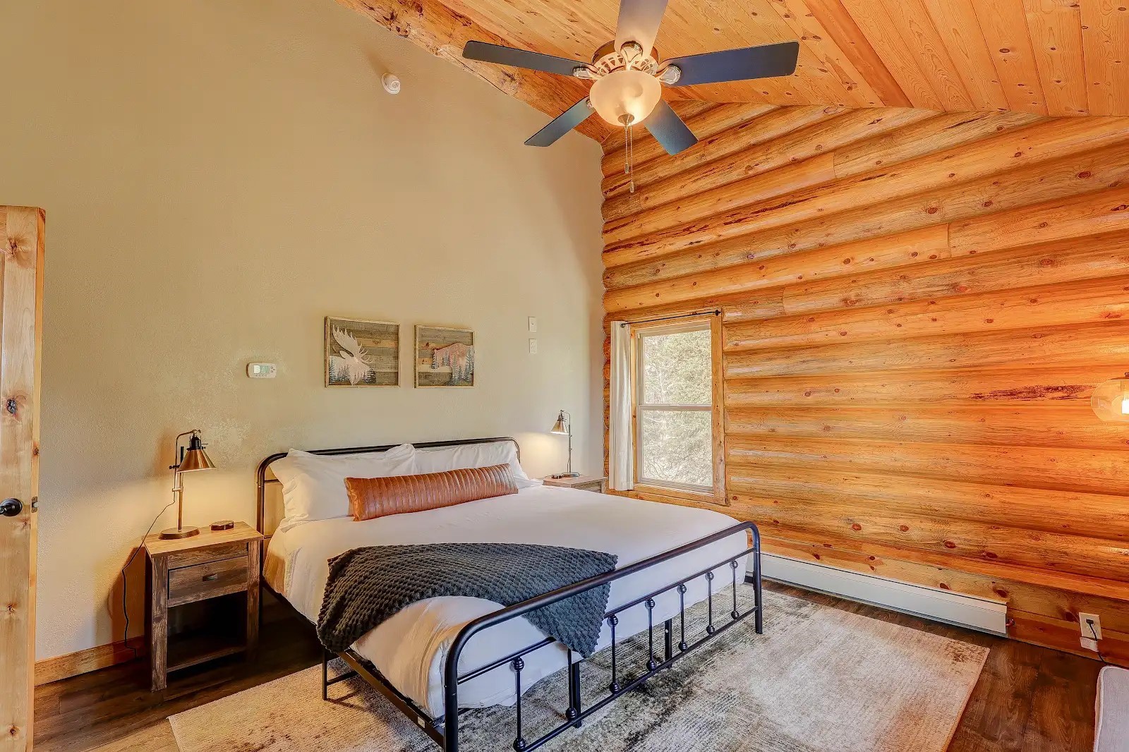 395 Miners Way Fairplay, CO 80440 - Photo 21 of 43 a bedroom with a bed and a chandelier