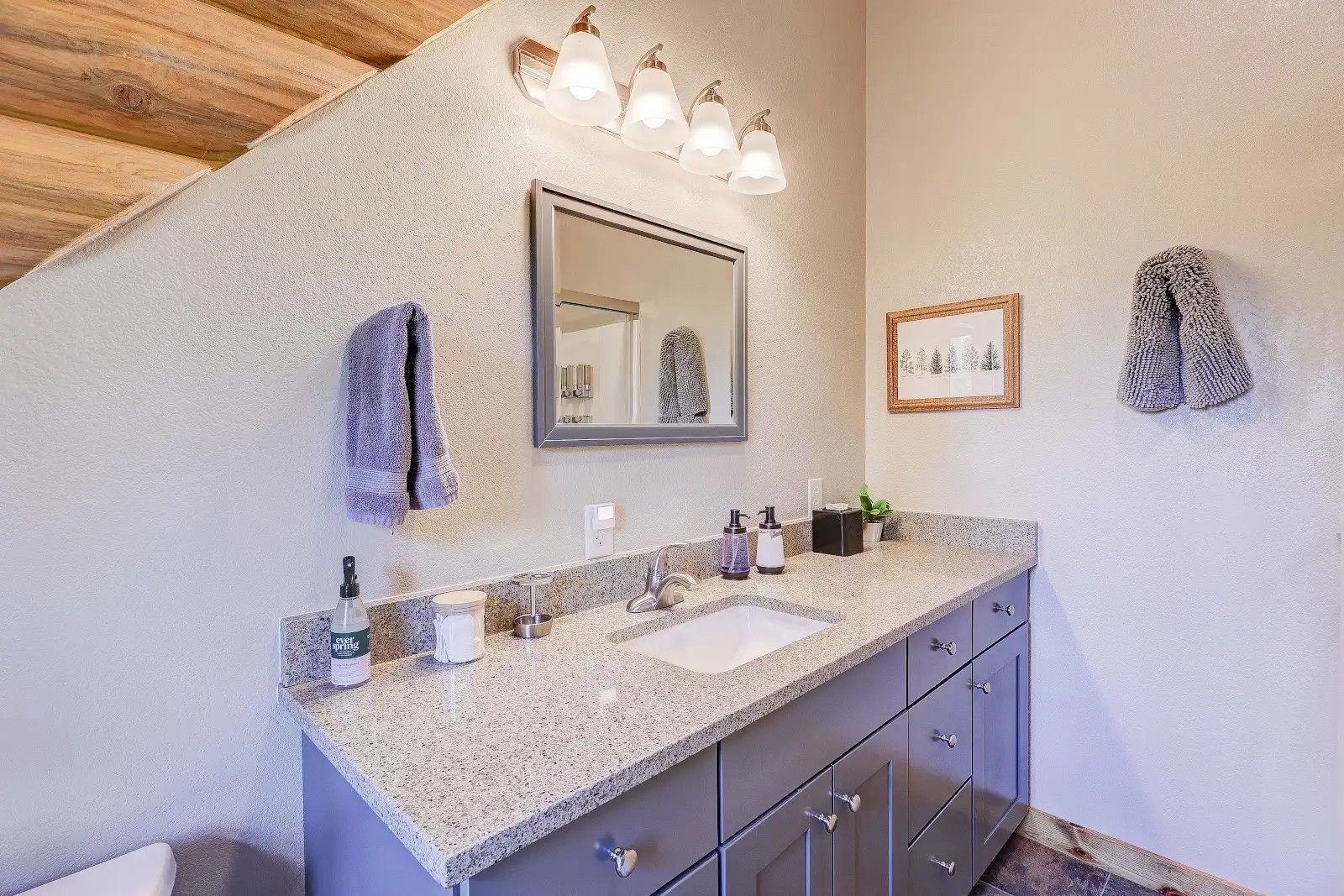 395 Miners Way Fairplay, CO 80440 - Photo 23 of 43 a bathroom with a granite countertop sink and a mirror