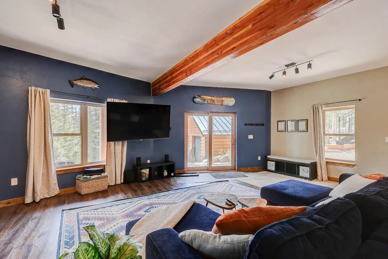 395 Miners Way Fairplay, CO 80440 - Photo 24 of 43 a living room with furniture and a flat screen tv with wooden floor