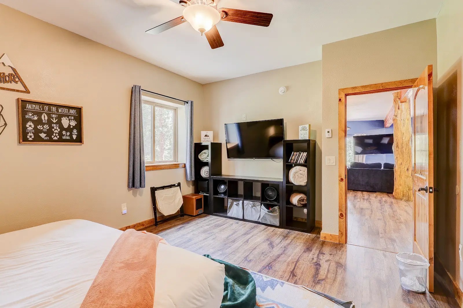 395 Miners Way Fairplay, CO 80440 - Photo 30 of 43 a bedroom with a bed and a flat tv screen on dresser