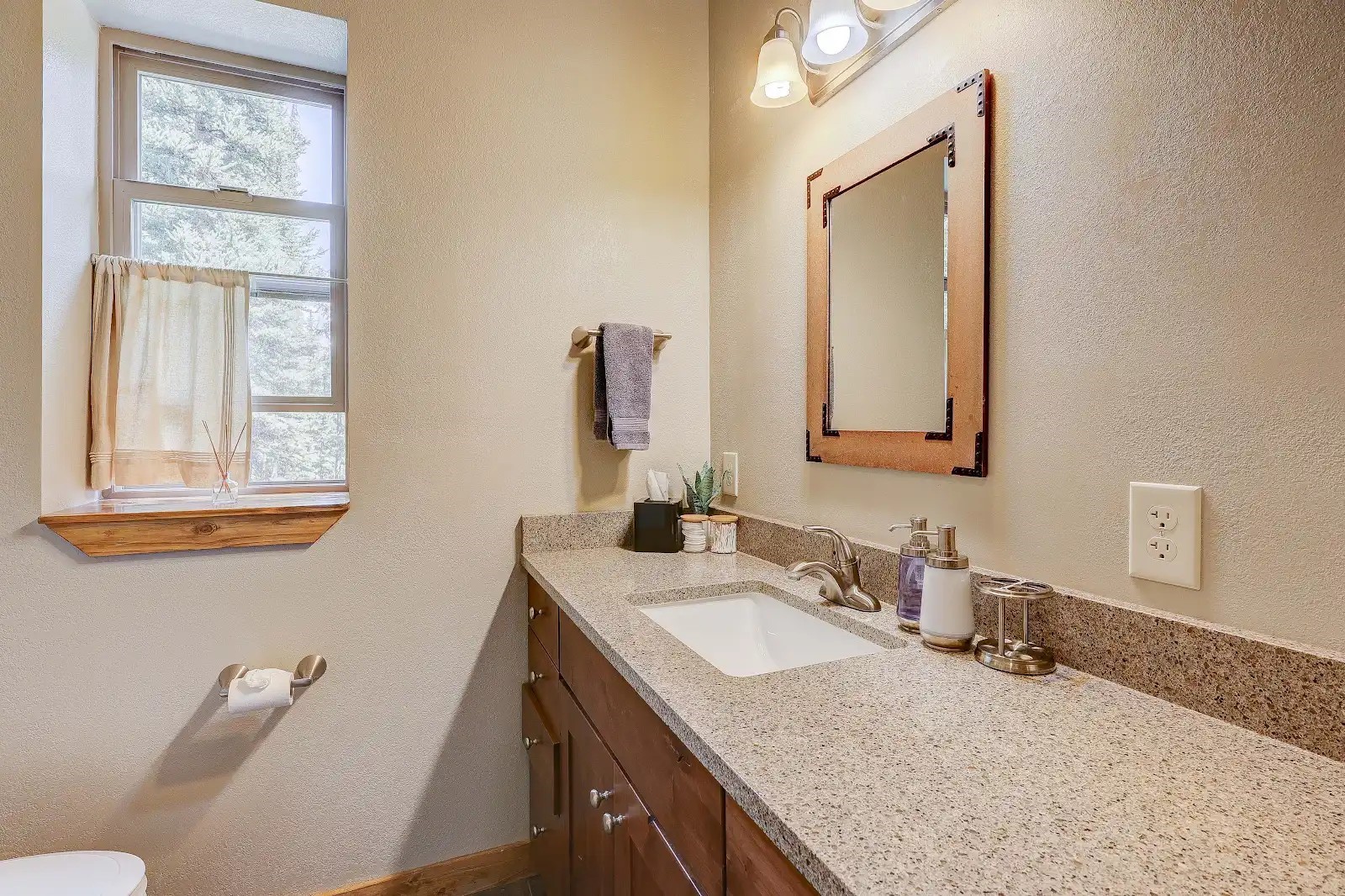 395 Miners Way Fairplay, CO 80440 - Photo 32 of 43 a bathroom with a granite countertop sink a mirror and a window