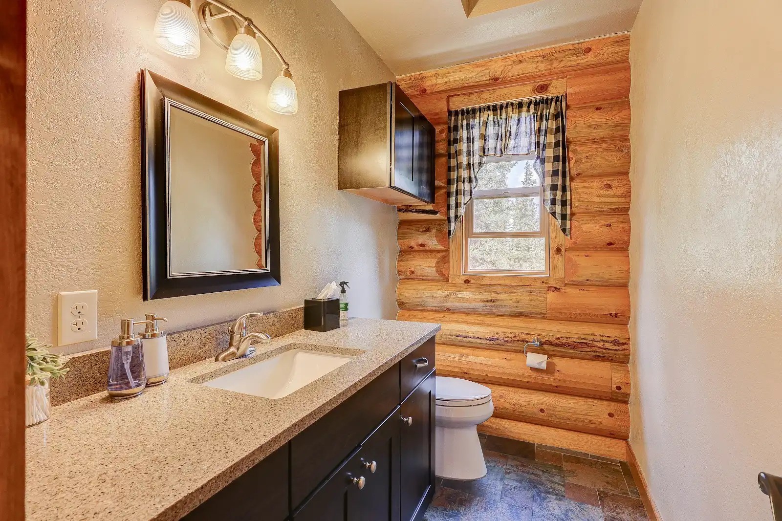 395 Miners Way Fairplay, CO 80440 - Photo 33 of 43 a bathroom with a granite countertop sink toilet and mirror