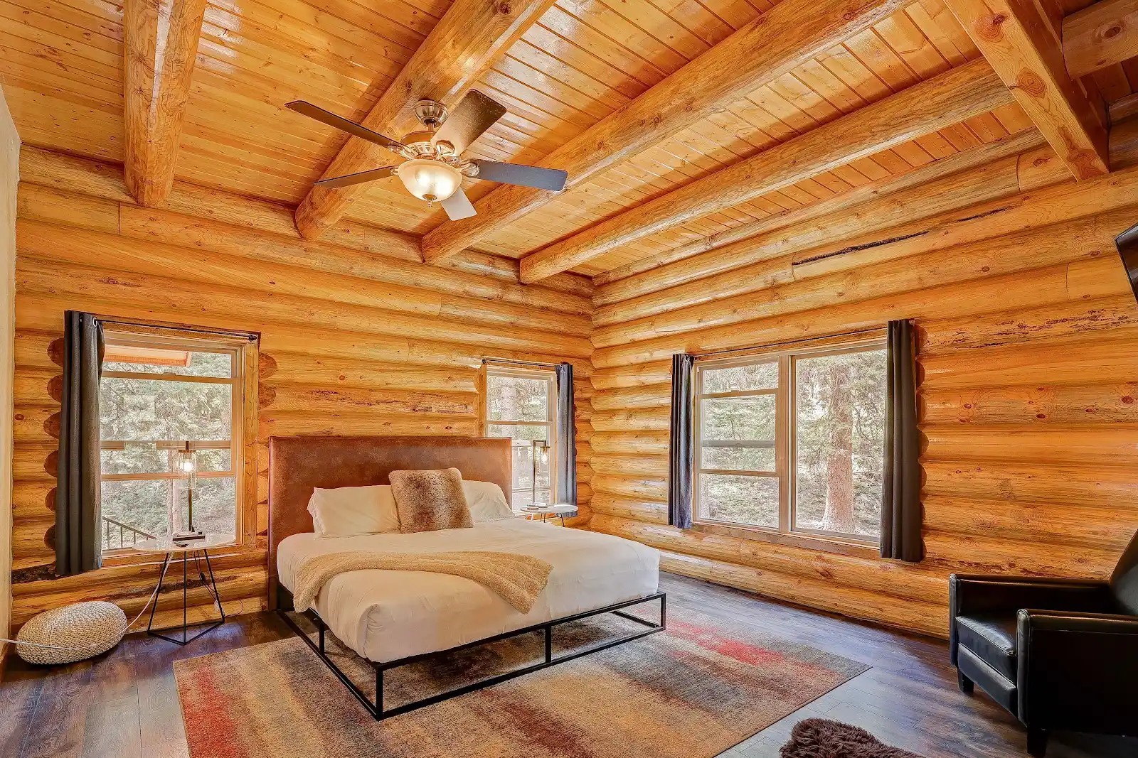 395 Miners Way Fairplay, CO 80440 - Photo 8 of 43 a spacious bedroom with a bed and wooden floor