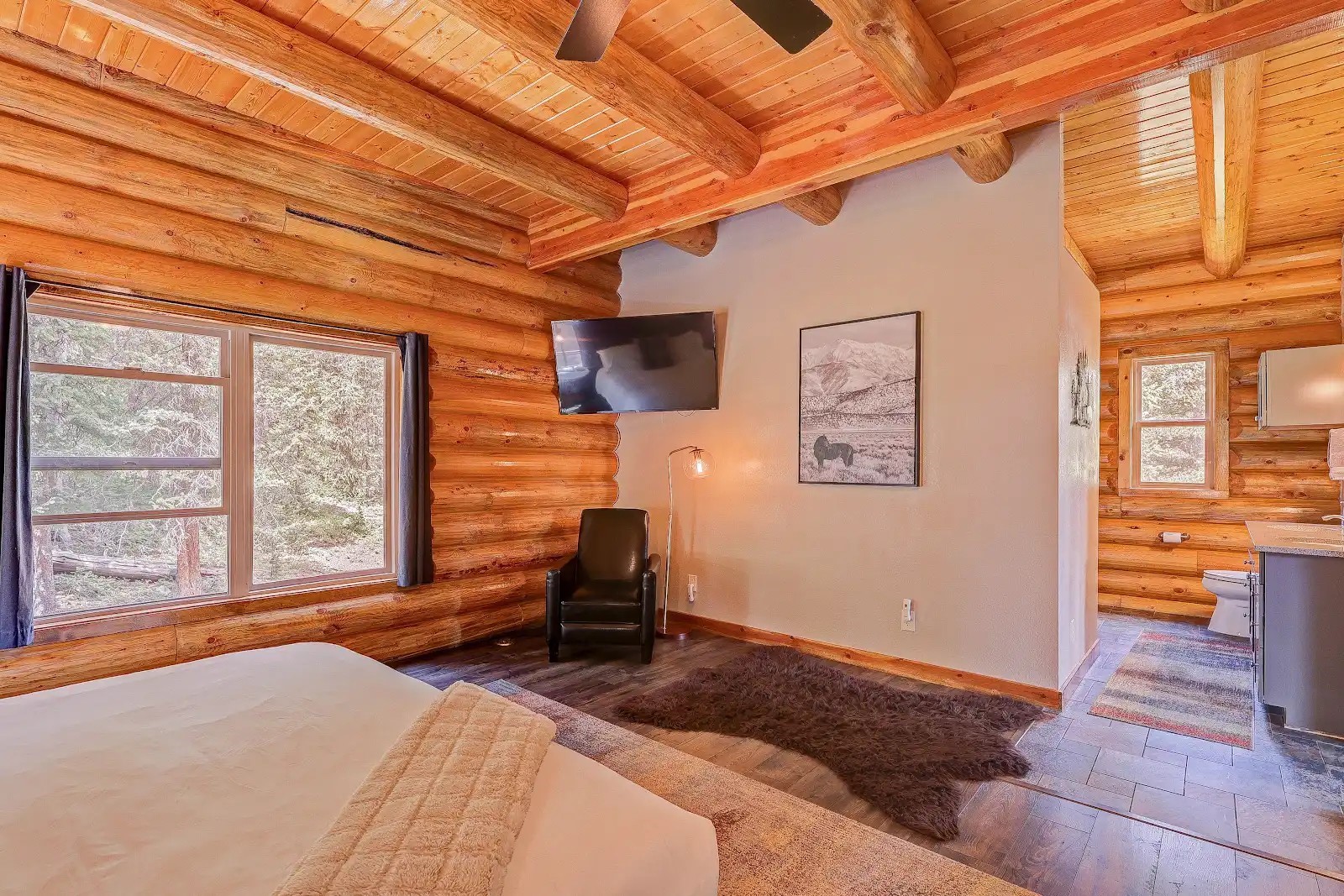 395 Miners Way Fairplay, CO 80440 - Photo 9 of 43 a bedroom with a bed and wooden floor