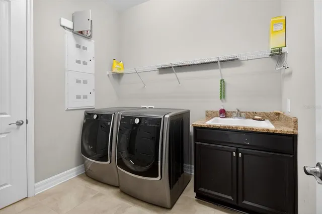 a kitchen with stainless steel appliances a refrigerator and a stove top oven