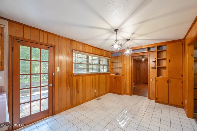 a kitchen with a sink a stove cabinets and counter space
