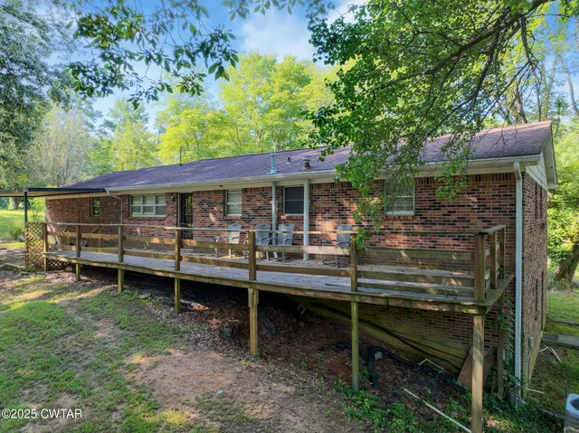a view of a balcony with trees