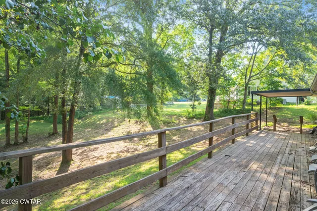 a yard with large trees