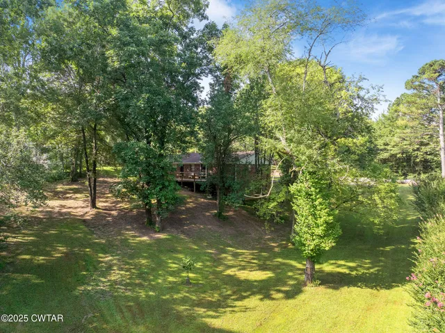 a view of outdoor space with signage and flags