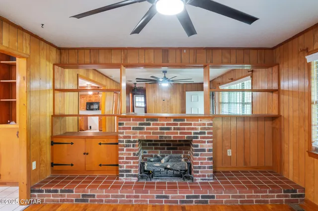 a room with fireplace and windows