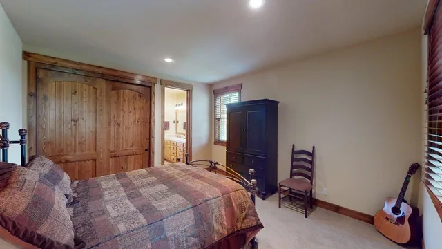 a bedroom with a bed and a desk