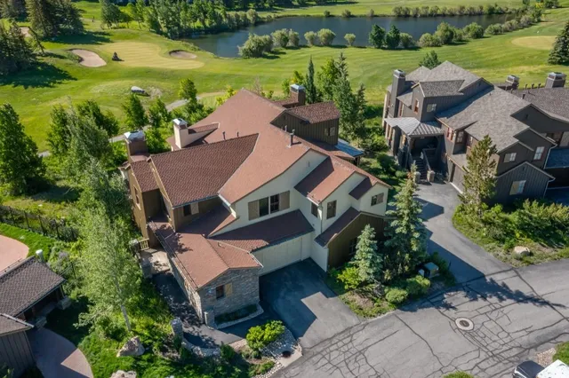 a aerial view of a house with a lake view