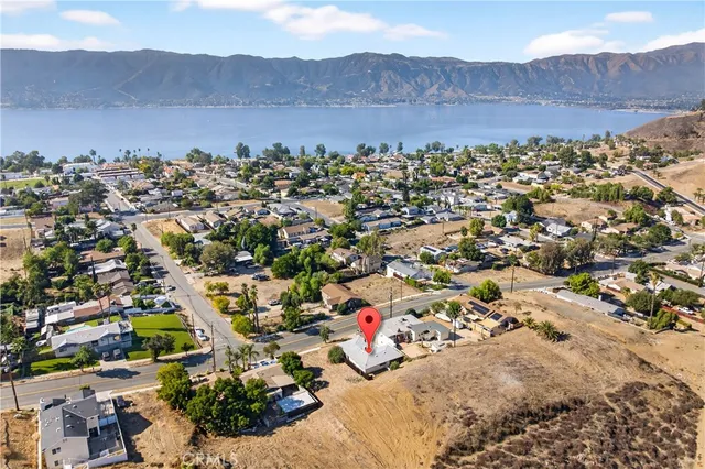 an aerial view of residential house with green space