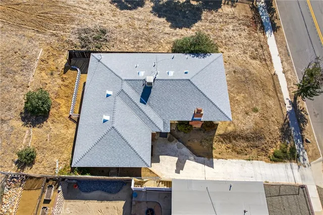 an aerial view of house with yard