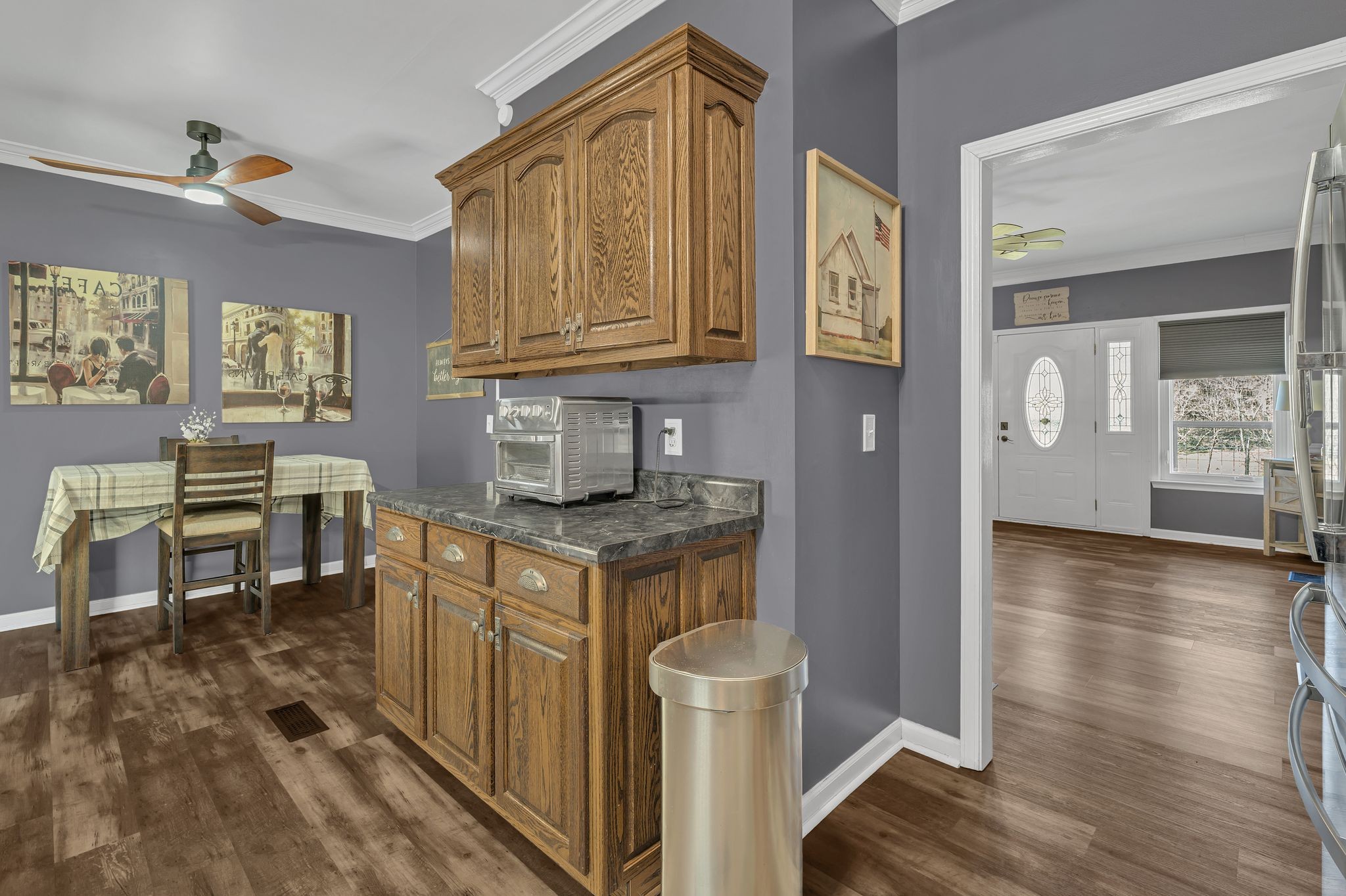 5063 Miller Lake Road Culleoka, TN 38451 - Photo 12 of 22 a kitchen with granite countertop a stove and cabinets