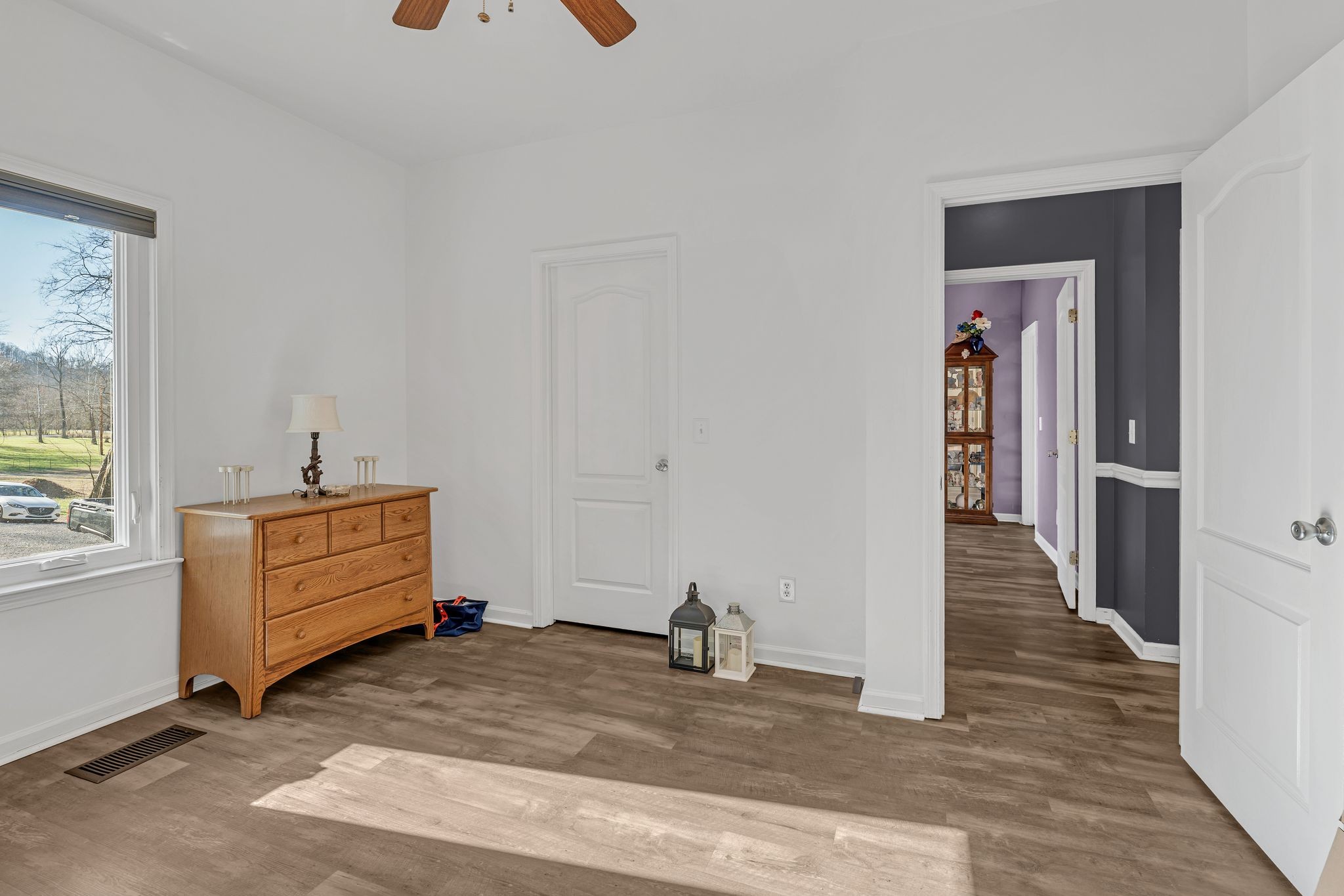 5063 Miller Lake Road Culleoka, TN 38451 - Photo 14 of 22 a view of a hallway with entryway wooden floor and cabinet