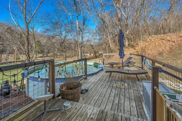 a view of balcony with wooden floor and outdoor seating