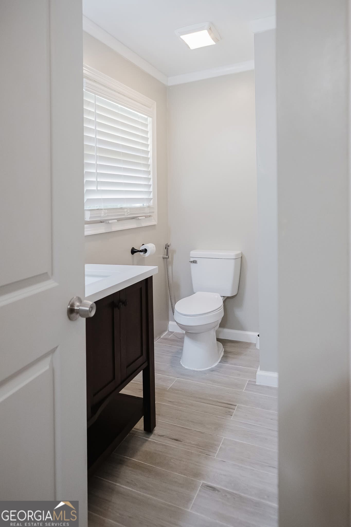 348 School Road Hampton, GA 30228 - Photo 18 of 46 a bathroom with a sink a toilet and a window