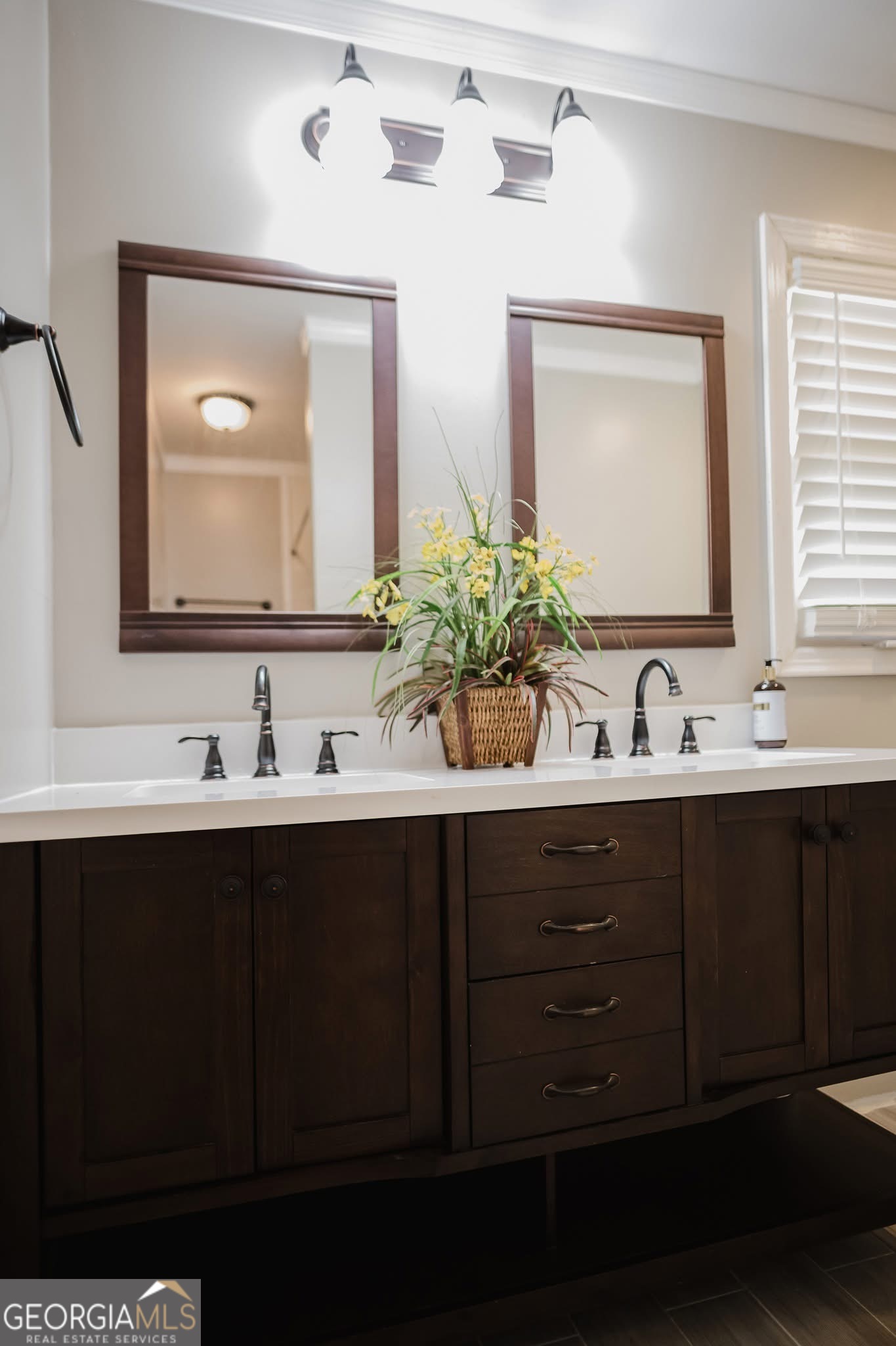 348 School Road Hampton, GA 30228 - Photo 20 of 46 a bathroom with double vanity sinks and a mirror