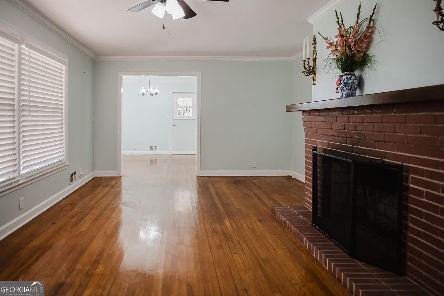 348 School Road Hampton, GA 30228 - Photo 2 of 46 a living room with wooden floor and a fireplace