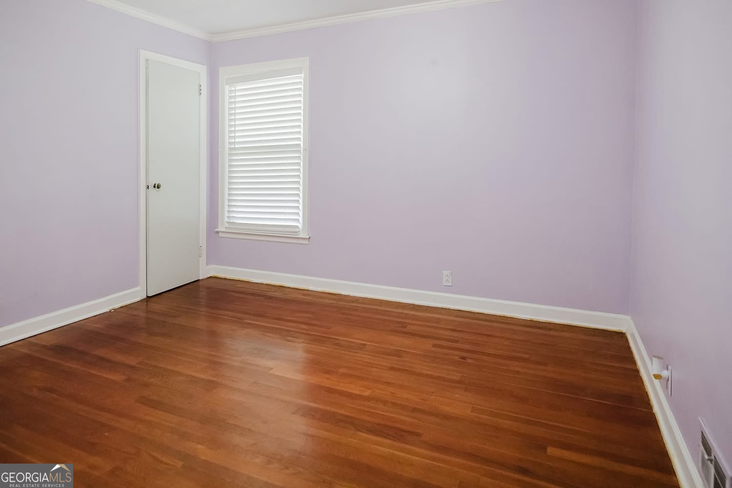 348 School Road Hampton, GA 30228 - Photo 23 of 46 a view of an empty room with wooden floor and a window
