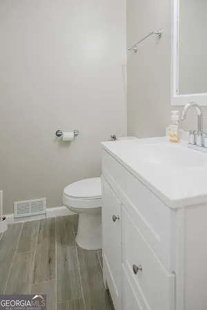 a bathroom with a sink and a toilet